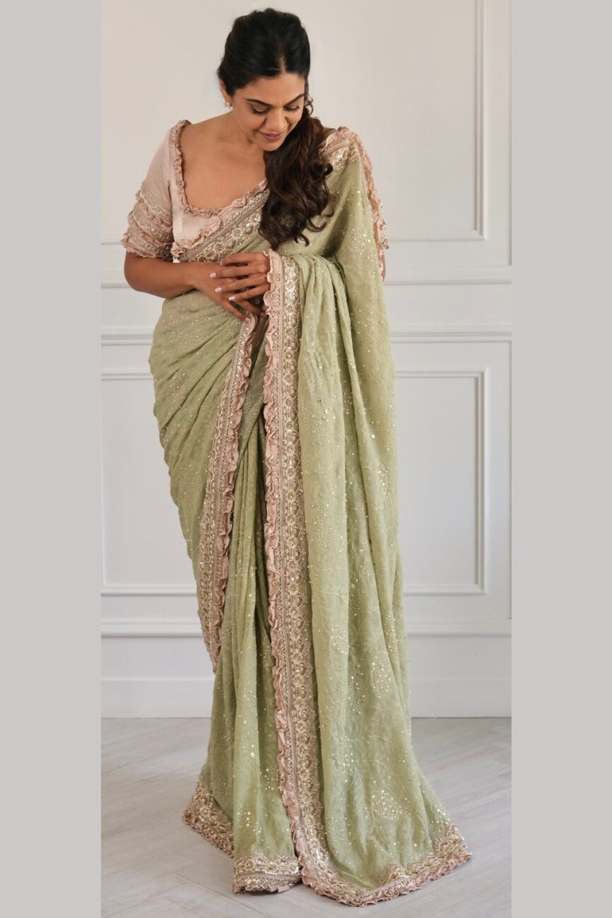 Green and taupe saree with chikankari embroidered border and pallu.