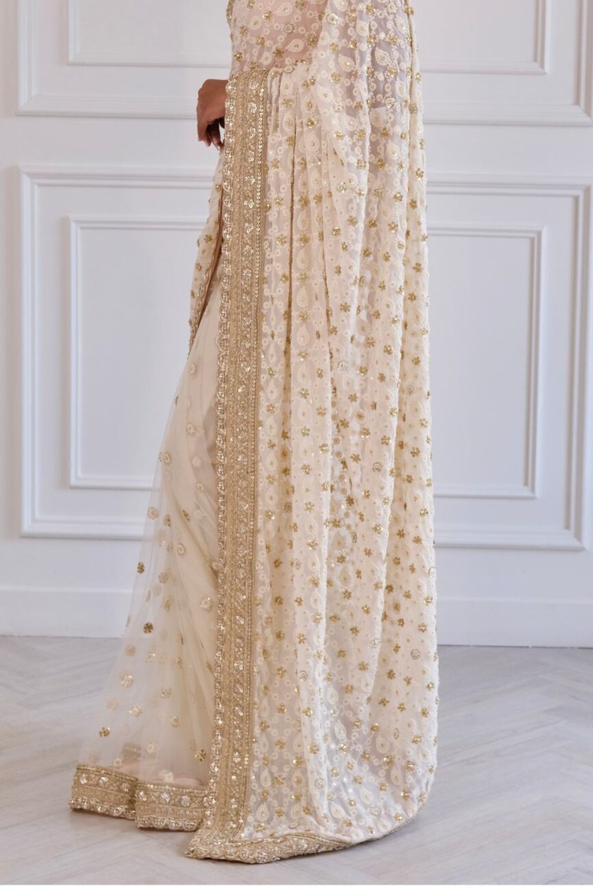 Ivory chikankari saree with hand-embroidered border and pallu design.