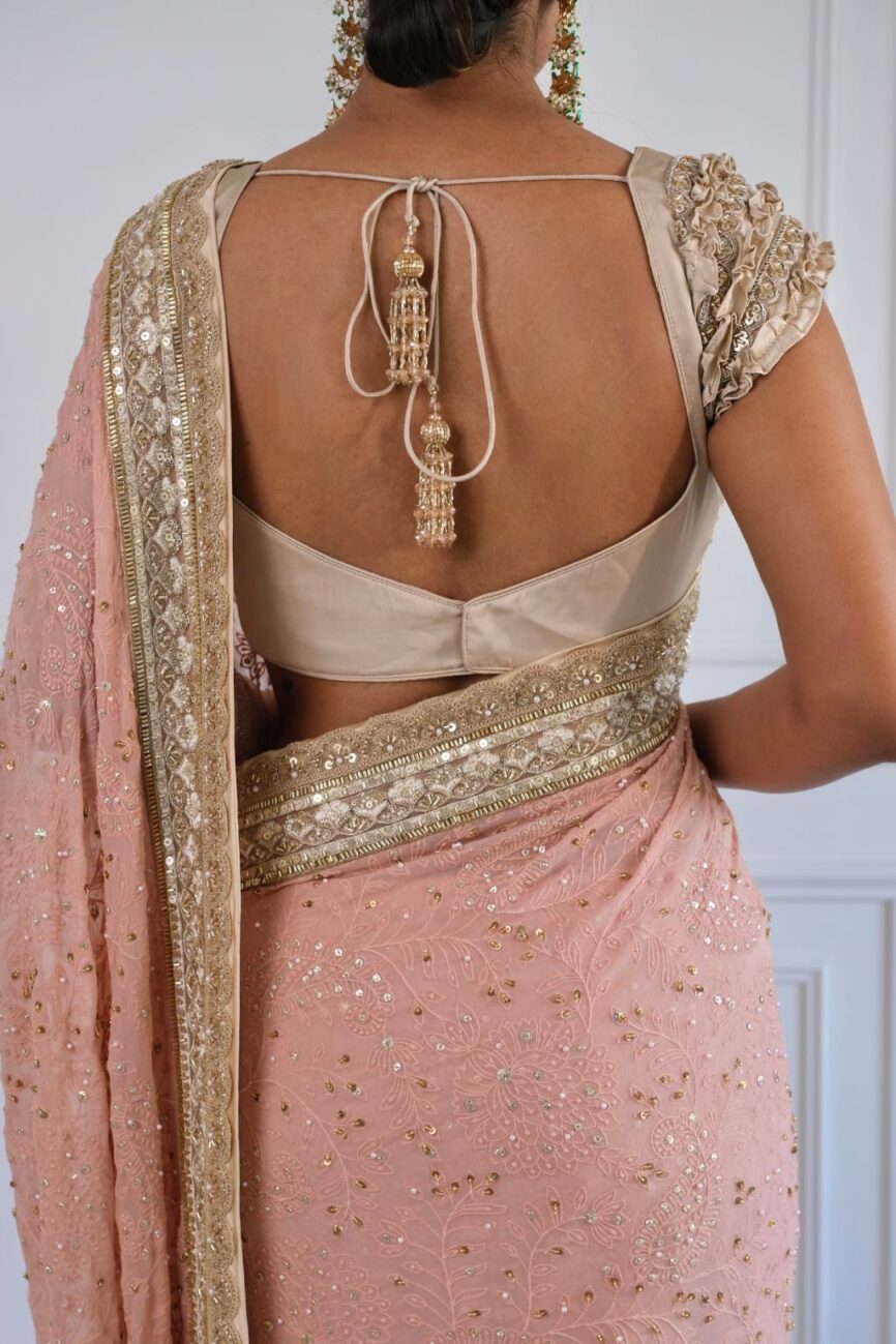 Model wearing pink and taupe hand-embroidered chikankari saree – designer bridal collection by SARA by Rashi.