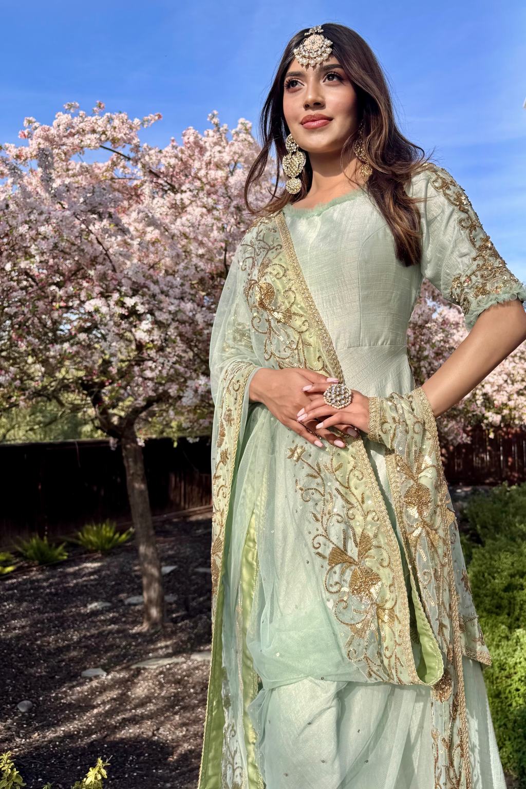 A styled model wearing the Seagreen Anarkali with Hand-Embroidered Dupatta, ideal for festive occasions, receptions, and weddings.