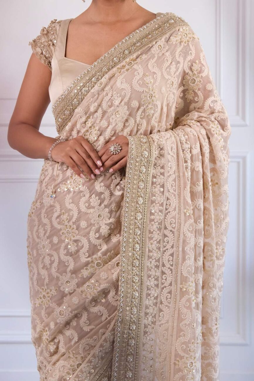 Intricate chikankari embroidery on taupe saree